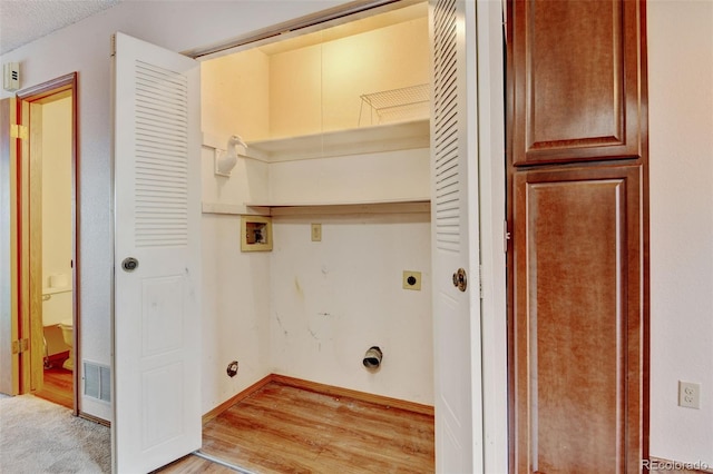 9188 W Ontario Dr, Littleton, CO 80128 - clothes washing area featuring electric dryer hookup, hookup for a washing machine, light wood finished floors, and baseboards