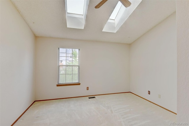 9188 W Ontario Dr, Littleton, CO 80128 - empty room with a skylight, ceiling fan, carpet, and baseboards