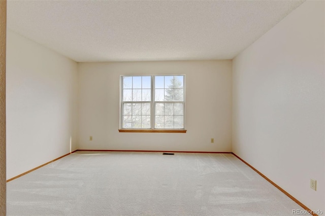 9188 W Ontario Dr, Littleton, CO 80128 - unfurnished room with carpet flooring, baseboards, and a textured ceiling