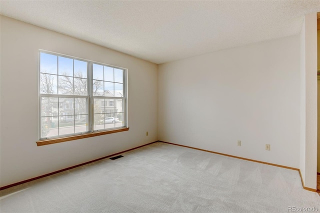 9188 W Ontario Dr, Littleton, CO 80128 - unfurnished room featuring light carpet, baseboards, and a textured ceiling
