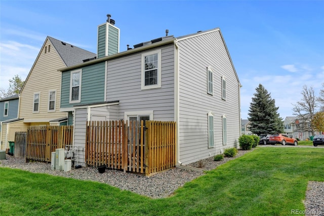 9188 W Ontario Dr, Littleton, CO 80128 - back of house featuring a chimney