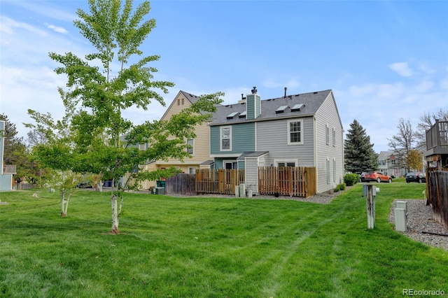 9188 W Ontario Dr, Littleton, CO 80128 - back of property featuring a chimney