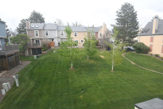 9188 W Ontario Dr, Littleton, CO 80128 - view of grassy yard featuring a residential view and a deck
