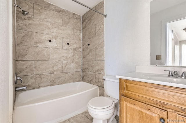 full bathroom with vanity, tile patterned floors, tiled shower / bath combo, and toilet