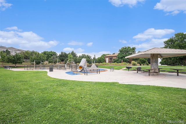 surrounding community featuring a playground and a lawn