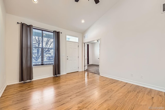 interior space with light wood finished floors, baseboards, and visible vents