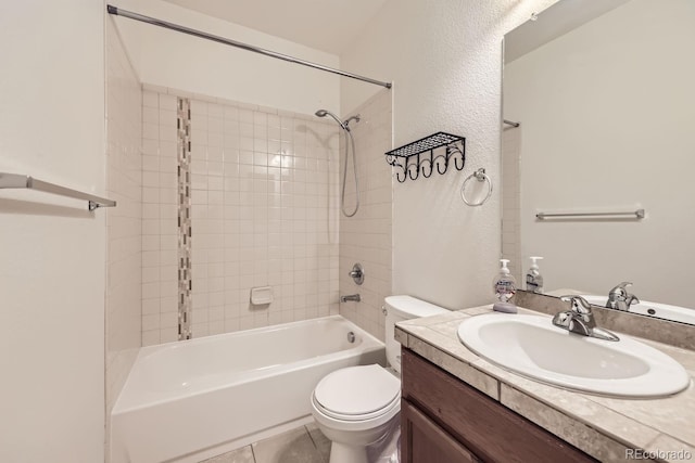 full bathroom featuring toilet, tile patterned flooring, vanity, and shower / bathing tub combination