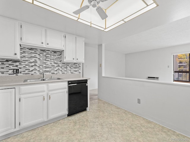 kitchen with ceiling fan, sink, dishwasher, backsplash, and white cabinets