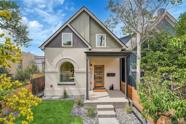 671 Elati St, Denver, CO 80204 - view of front of property with stucco siding and board and batten siding