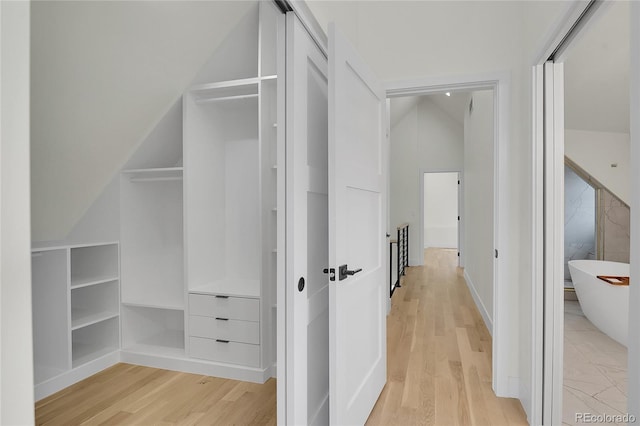 671 Elati St, Denver, CO 80204 - hall featuring light wood-type flooring and vaulted ceiling
