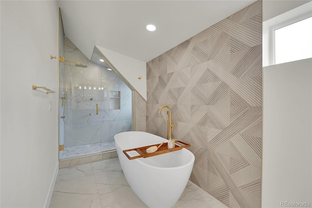 671 Elati St, Denver, CO 80204 - bathroom with marble look tiles, recessed lighting, a marble finish shower, a freestanding bath, and baseboards