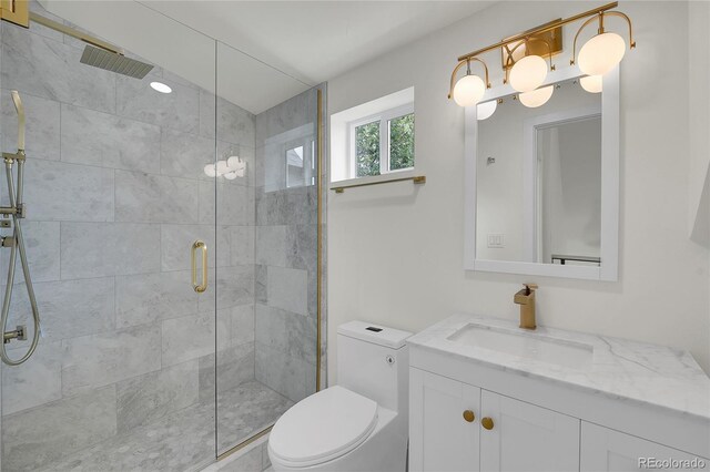 671 Elati St, Denver, CO 80204 - full bath featuring vanity, toilet, and a stall shower