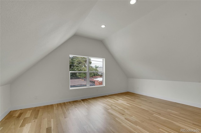 671 Elati St, Denver, CO 80204 - bonus room with lofted ceiling, light wood-style flooring, baseboards, and recessed lighting