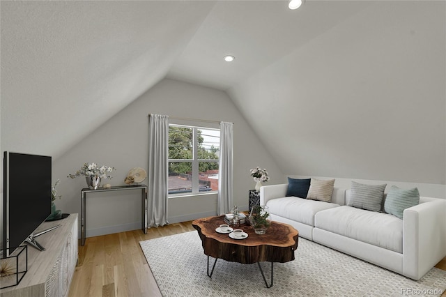 671 Elati St, Denver, CO 80204 - living room featuring vaulted ceiling, light wood-style flooring, recessed lighting, and baseboards