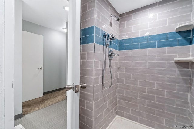 bathroom with tiled shower