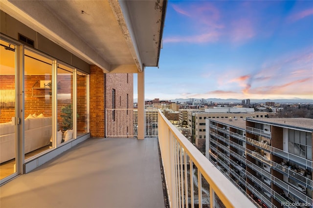 balcony at dusk with a view of city