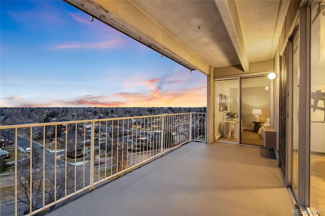 view of balcony at dusk