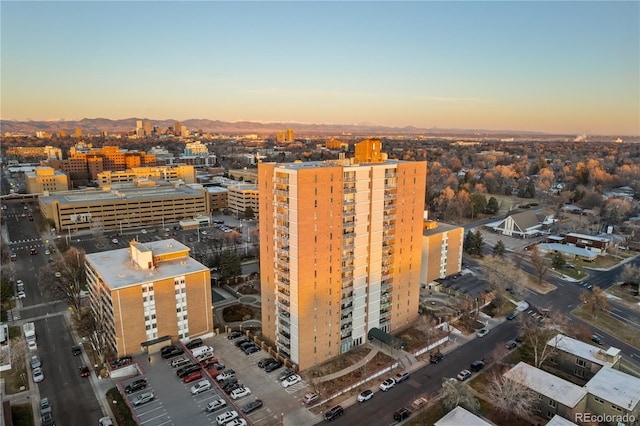 aerial view at dusk featuring a view of city