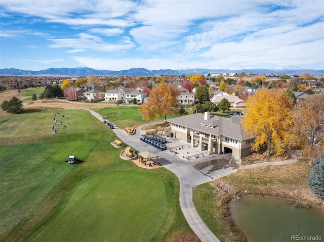 bird's eye view featuring view of golf course, a mountain view, and a residential view