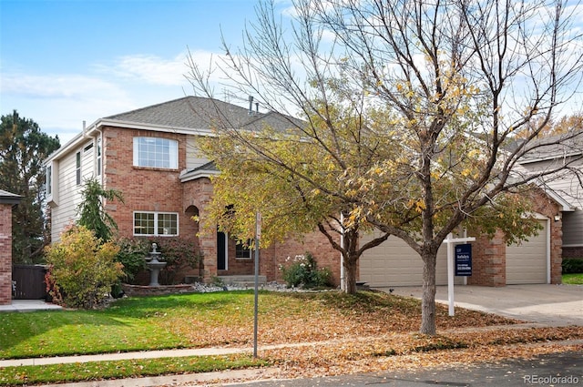 traditional-style home with concrete driveway, brick siding, an attached garage, and a front lawn