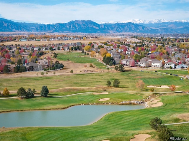 view of property's community with a water and mountain view, view of golf course, and a residential view