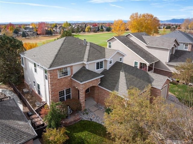 birds eye view of property with a mountain view and a residential view