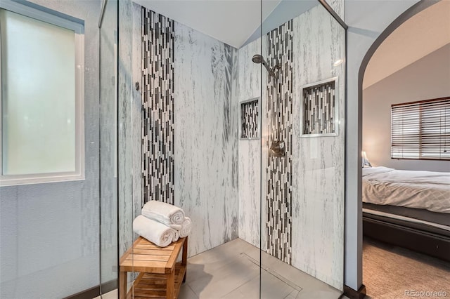 interior space featuring walk in shower and lofted ceiling