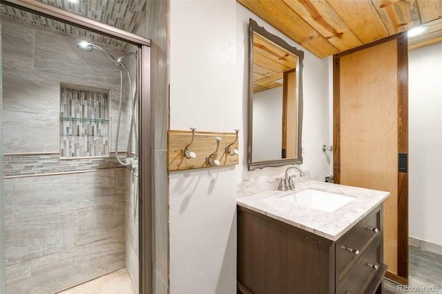full bathroom with a stall shower and vanity
