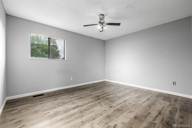9832 High St, Thornton, CO 80229 - empty room featuring wood finished floors, ceiling fan, baseboards, and a textured ceiling
