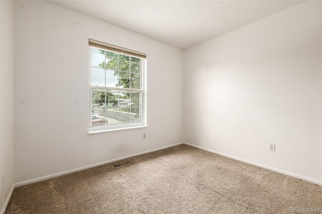 9832 High St, Thornton, CO 80229 - empty room with carpet floors, baseboards, and a textured ceiling