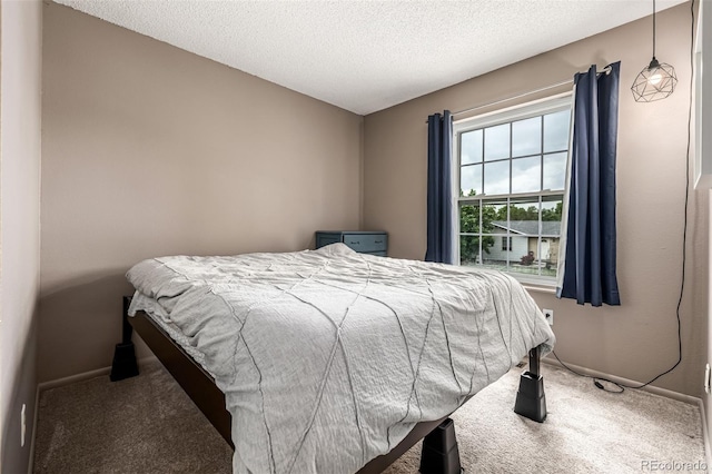 9832 High St, Thornton, CO 80229 - bedroom featuring carpet flooring, baseboards, and a textured ceiling