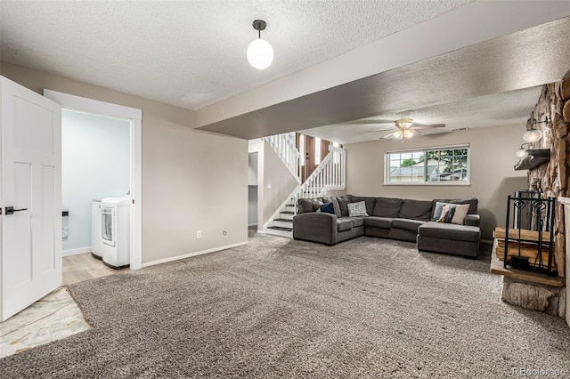 9832 High St, Thornton, CO 80229 - living room with washer / dryer, a textured ceiling, light carpet, stairs, and a ceiling fan