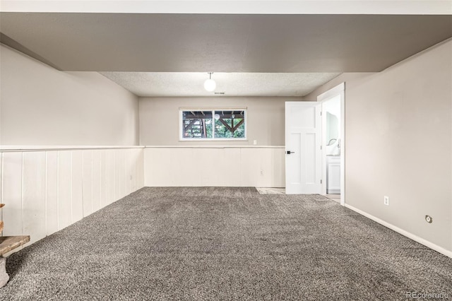 9832 High St, Thornton, CO 80229 - carpeted spare room with a wainscoted wall and a textured ceiling