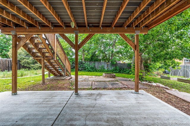 9832 High St, Thornton, CO 80229 - fenced backyard featuring a fire pit, a patio, and stairs