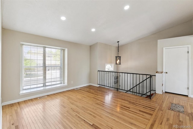 5886 S Nepal Way, Centennial, CO 80015 - spare room featuring hardwood / wood-style floors, recessed lighting, baseboards, and vaulted ceiling