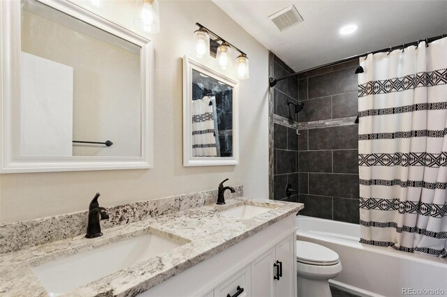 5886 S Nepal Way, Centennial, CO 80015 - full bathroom with double vanity, shower / tub combo with curtain, toilet, and recessed lighting