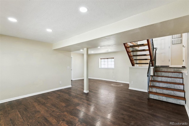 5886 S Nepal Way, Centennial, CO 80015 - basement featuring stairs, wood finished floors, baseboards, a textured ceiling, and recessed lighting