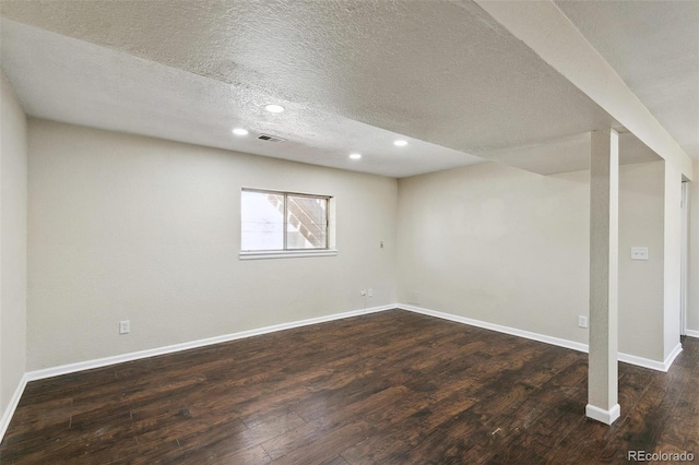 5886 S Nepal Way, Centennial, CO 80015 - basement with dark wood-style flooring, a textured ceiling, recessed lighting, and baseboards