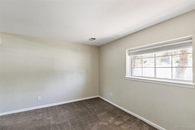 5886 S Nepal Way, Centennial, CO 80015 - spare room with baseboards and dark carpet