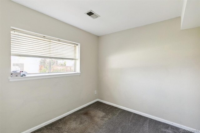 5886 S Nepal Way, Centennial, CO 80015 - spare room featuring dark colored carpet and baseboards