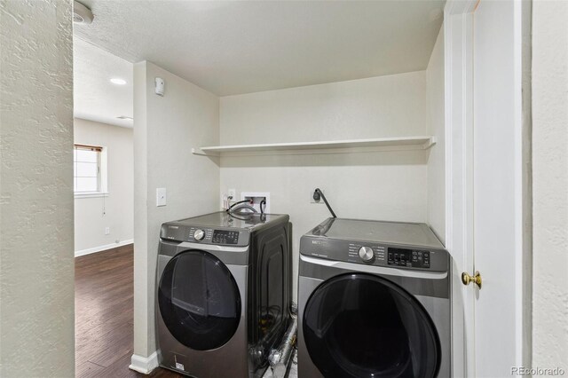 5886 S Nepal Way, Centennial, CO 80015 - washroom with washing machine and dryer, wood finished floors, baseboards, and a textured wall