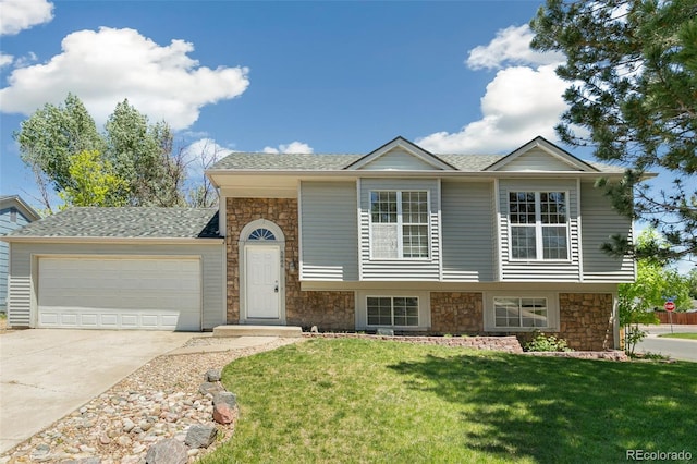 5886 S Nepal Way, Centennial, CO 80015 - view of front of property with stone siding, driveway, a front yard, an attached garage, and roof with shingles