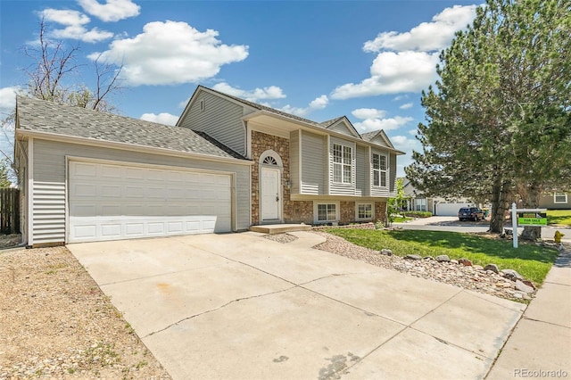 5886 S Nepal Way, Centennial, CO 80015 - view of front facade featuring stone siding, driveway, and an attached garage