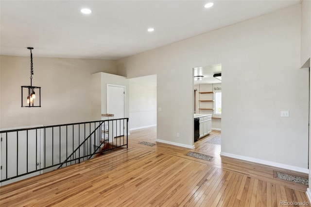 5886 S Nepal Way, Centennial, CO 80015 - unfurnished room featuring light wood-style flooring, baseboards, a chandelier, and recessed lighting