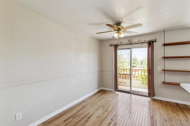 5886 S Nepal Way, Centennial, CO 80015 - spare room with wood-type flooring, a ceiling fan, and baseboards
