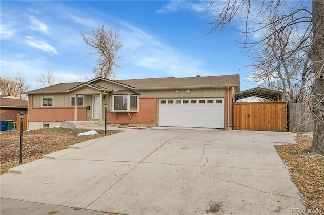 ranch-style home featuring a garage and a carport