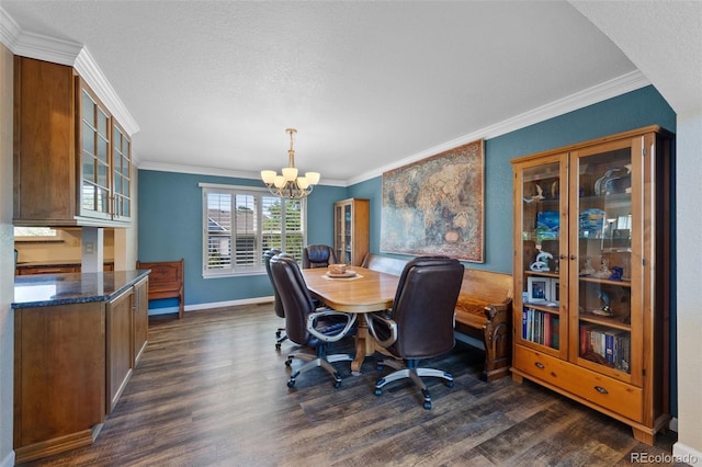 dining space featuring a textured ceiling, ornamental molding, dark hardwood / wood-style floors, and a chandelier