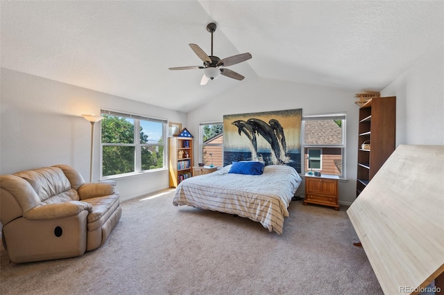 bedroom featuring carpet floors, lofted ceiling, and ceiling fan