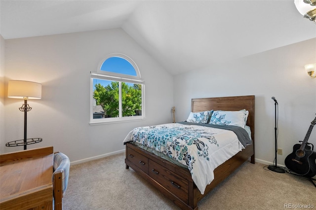 bedroom featuring light carpet and lofted ceiling