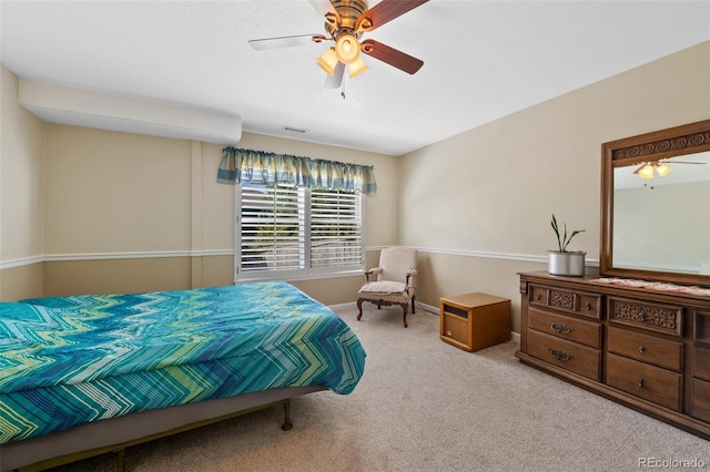 bedroom featuring ceiling fan and light colored carpet